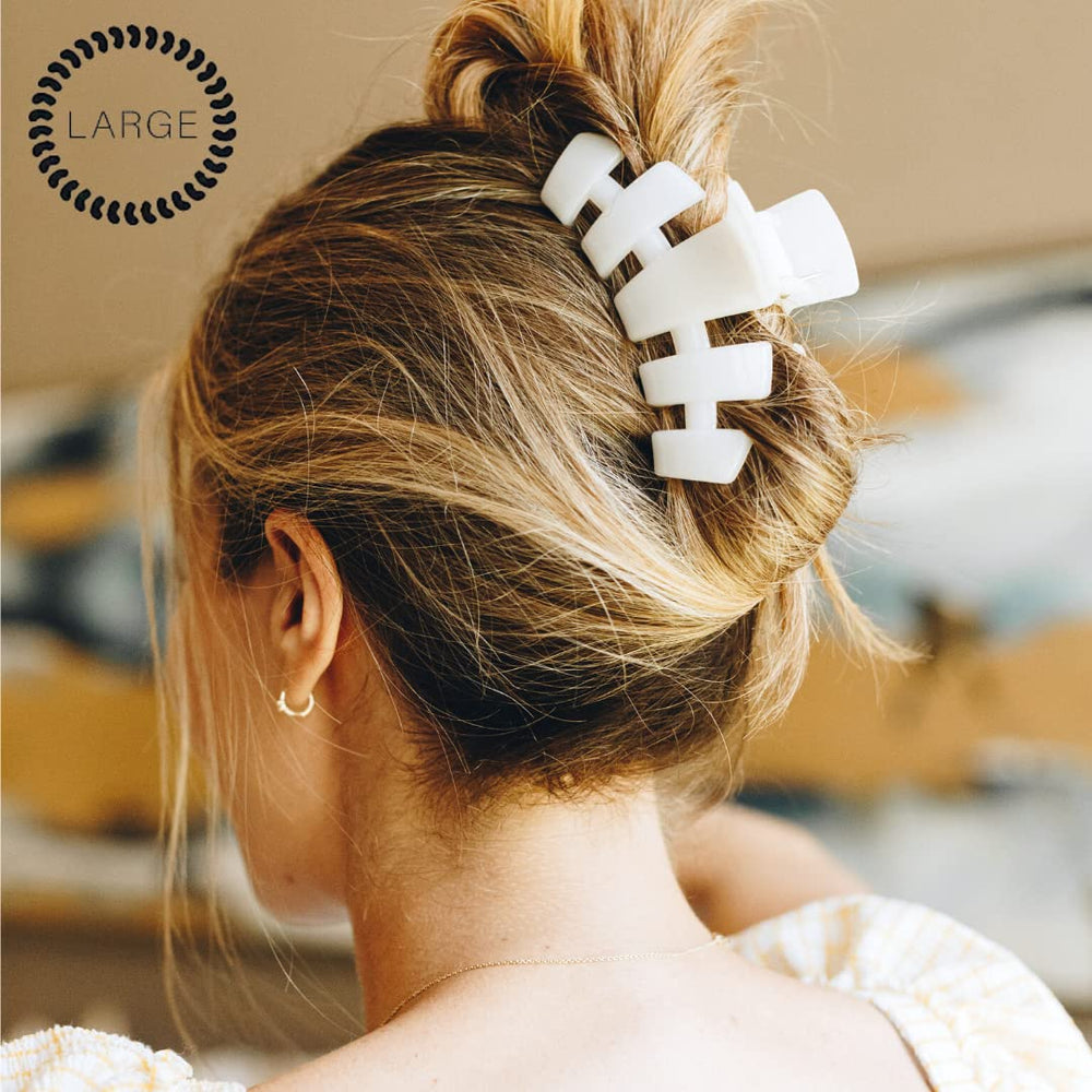Teleties coconut white clip on a ponytail demonstrates comfortable curved design for all-day wear.