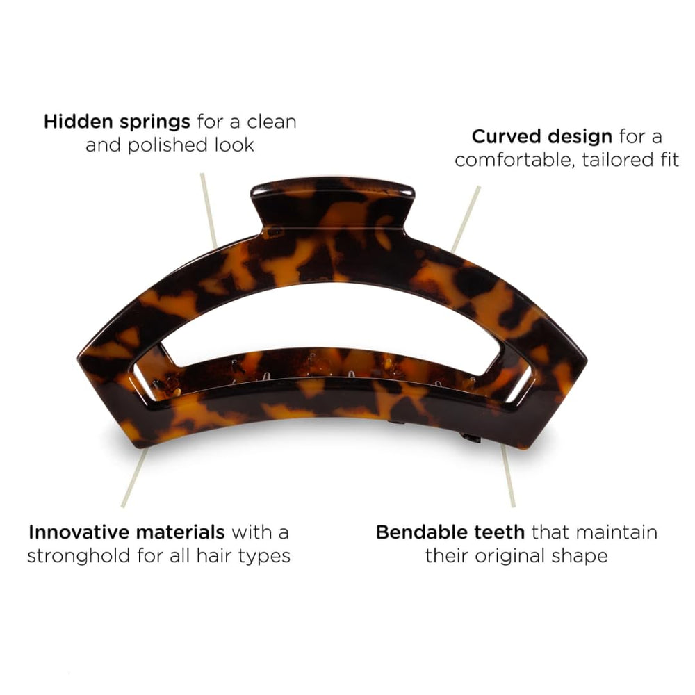Teleties open claw clip tortoise comfort-fit design shown while holding waves.