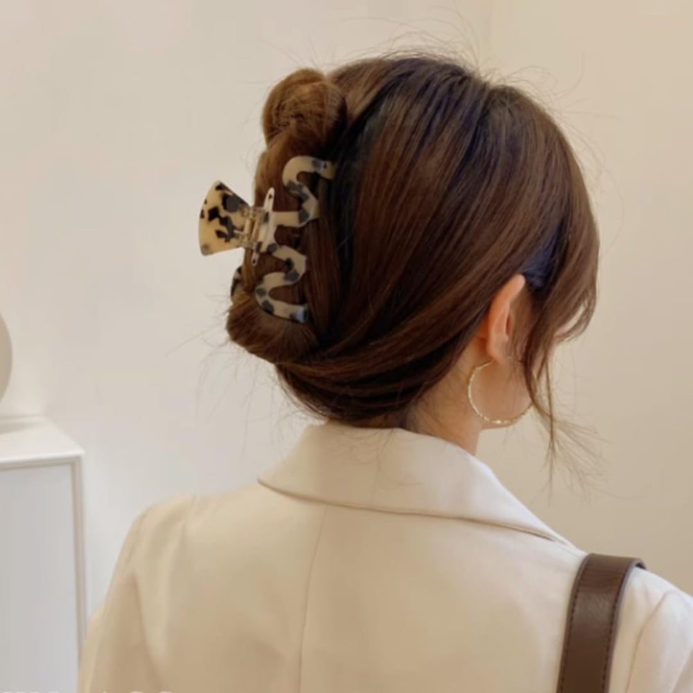 Textention checkered pattern clip shown in thick hair for strong hold
