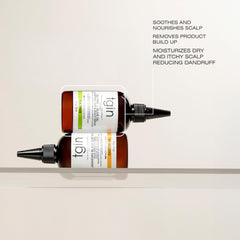 tgin Tea Tree Olive Oil Serum applied to the scalp showing soothing hydration