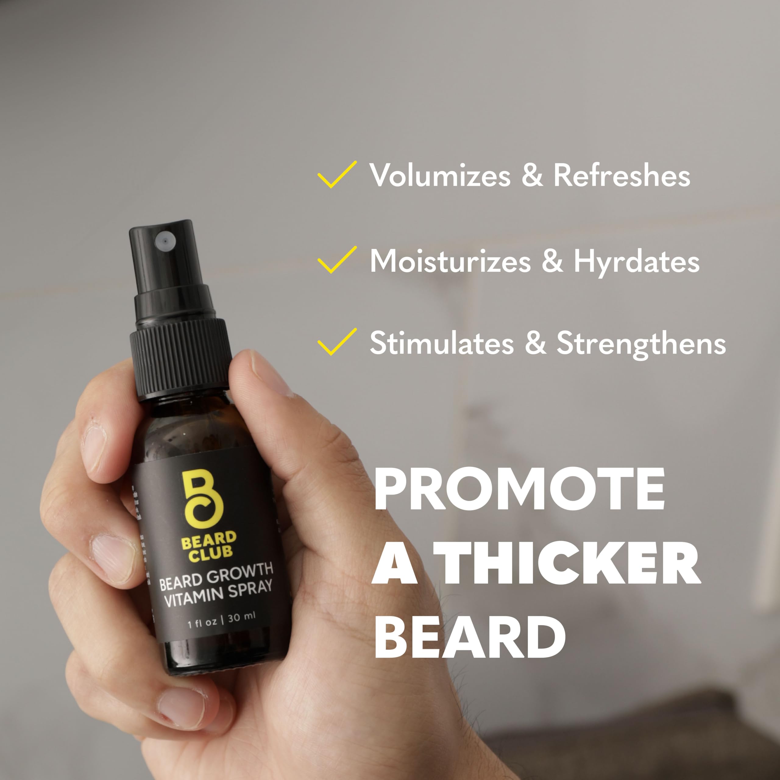 The Beard Club Biotin Vitamin Spray in hands shows convenient, mess-free application.
