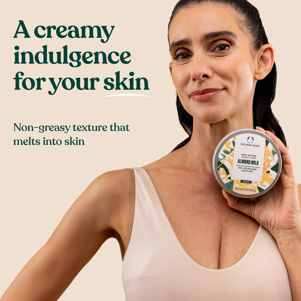 The Body Shop almond milk body butter after shower on hands shows hydration and comfort.