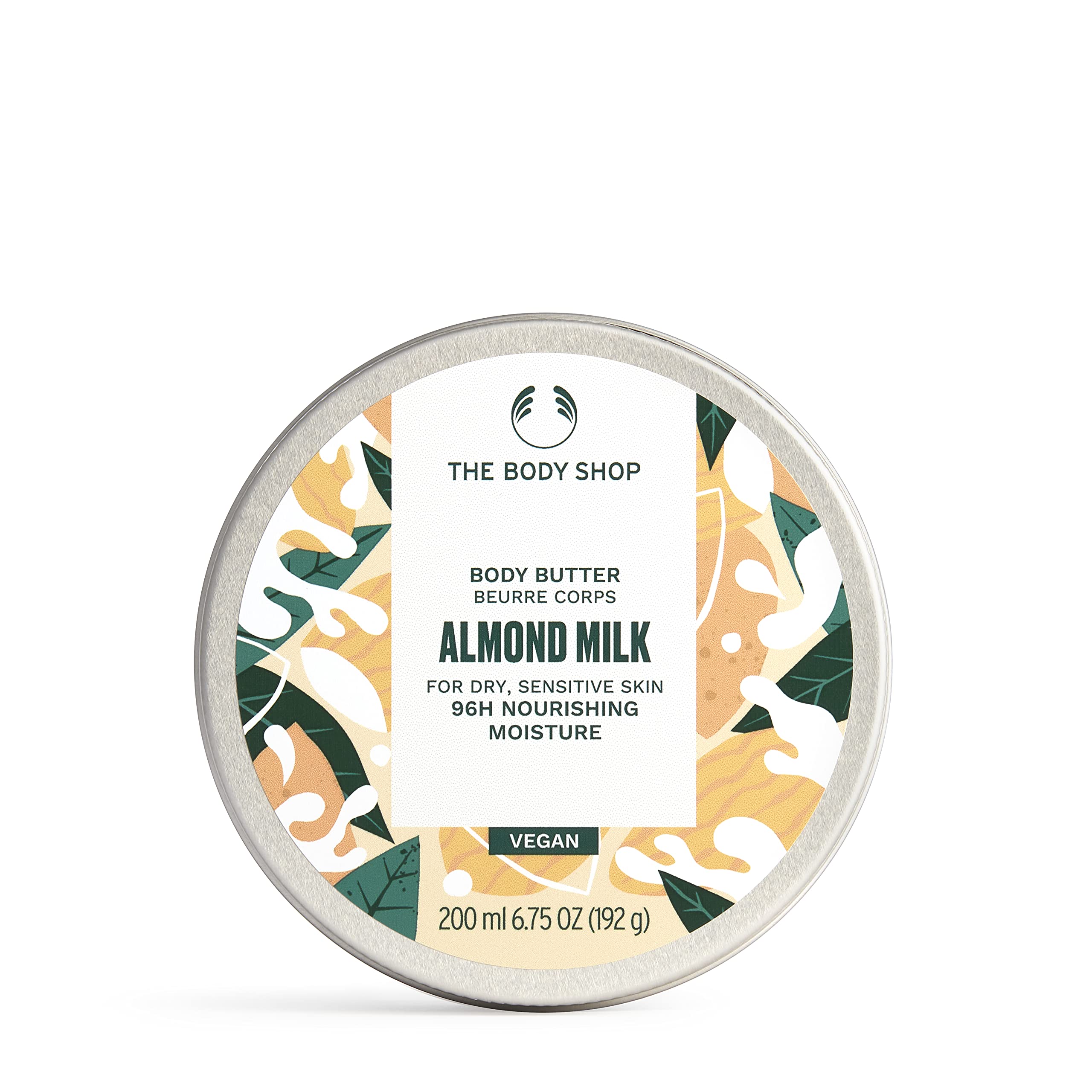 The Body Shop almond milk body butter jar closeup shows velvety moisture for dry skin.