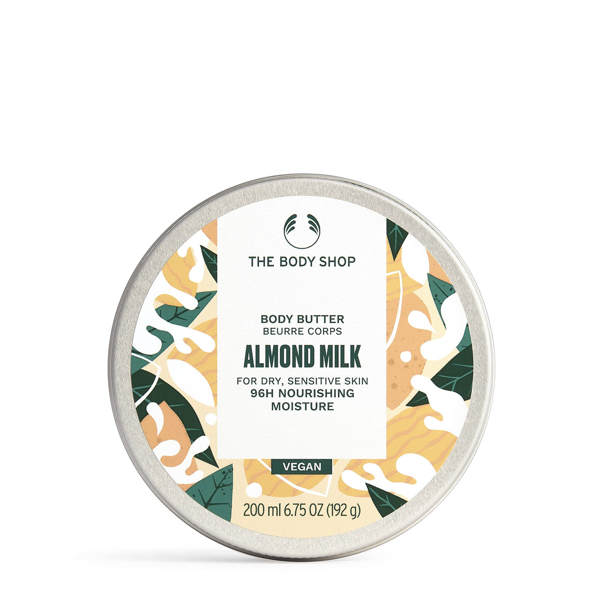 The Body Shop almond milk body butter jar closeup shows velvety moisture for dry skin.