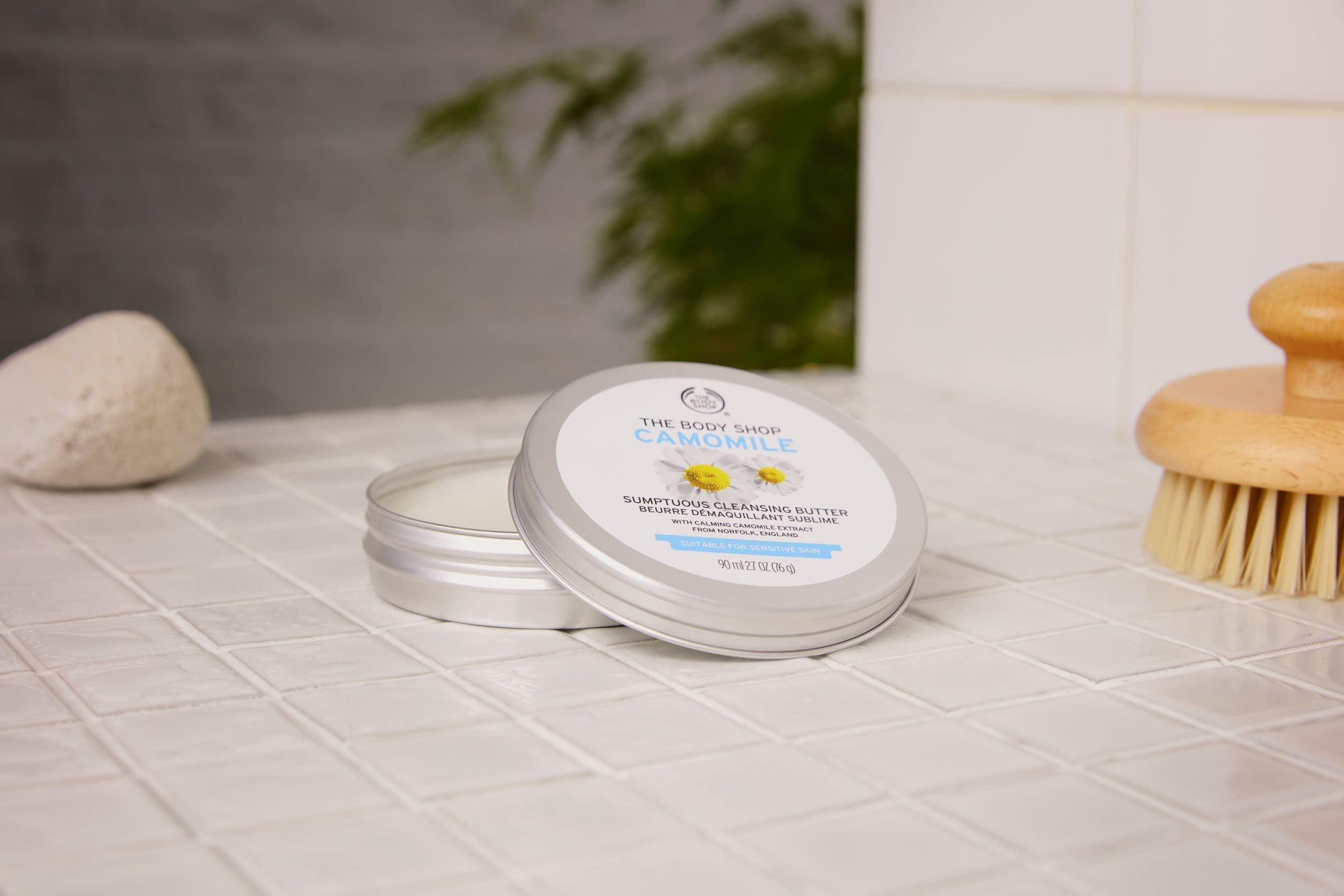 The Body Shop Camomile Sumptuous Cleansing Butter scoop application shows creamy texture for makeup removal.