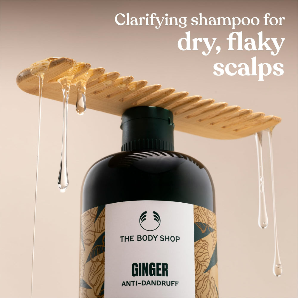 The Body Shop Ginger Scalp Care Shampoo lather close-up suggests cleansing texture and scalp comfort