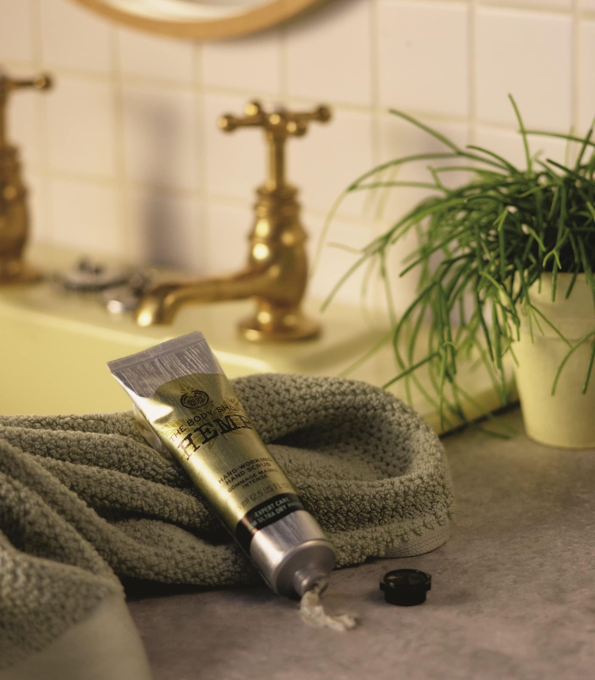 The Body Shop Hemp Hand Protector cream on hand shows velvety texture and soothing moisture