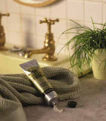 The Body Shop Hemp Hand Protector cream on hand shows velvety texture and soothing moisture