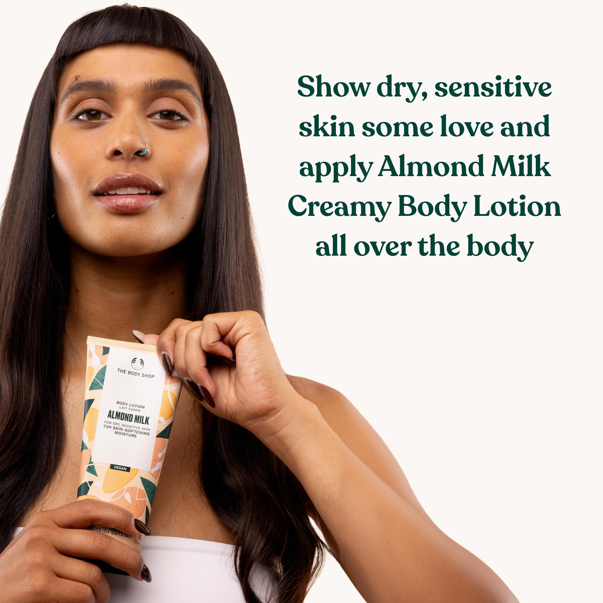 Recycled plastic tube packaging of The Body Shop lotion reducing waste.