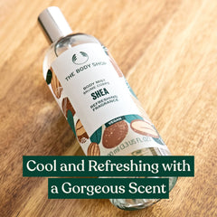 The Body Shop Shea Body Mist spray mid-application for refreshing aroma