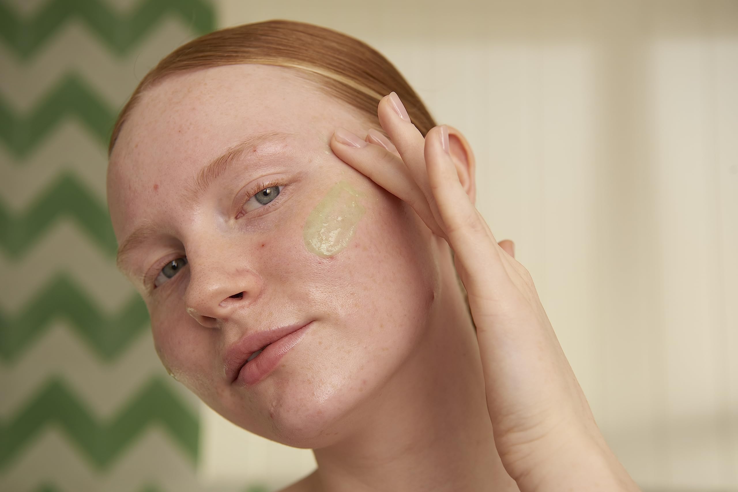 The Body Shop Tea Tree Scrub applying on the face demonstrates gentle cleansing and oil control