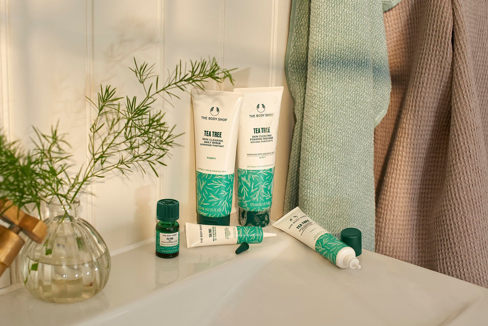The Body Shop Tea Tree Scrub packaging highlights vegan certification and Community Fair Trade tea tree oil