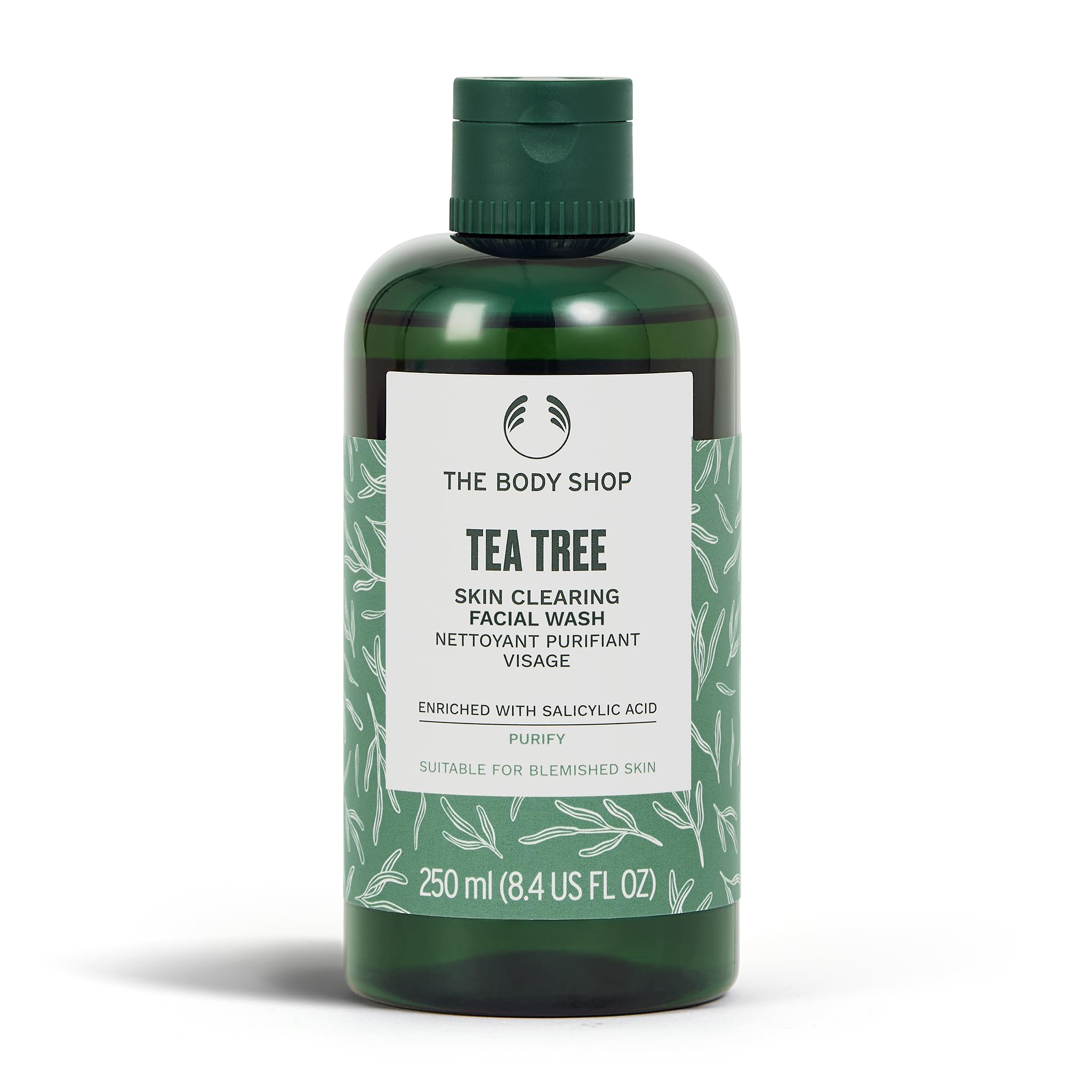 The Body Shop Tea Tree Skin Clearing Facial Wash bottle close-up, promoting balanced, clear-looking skin.