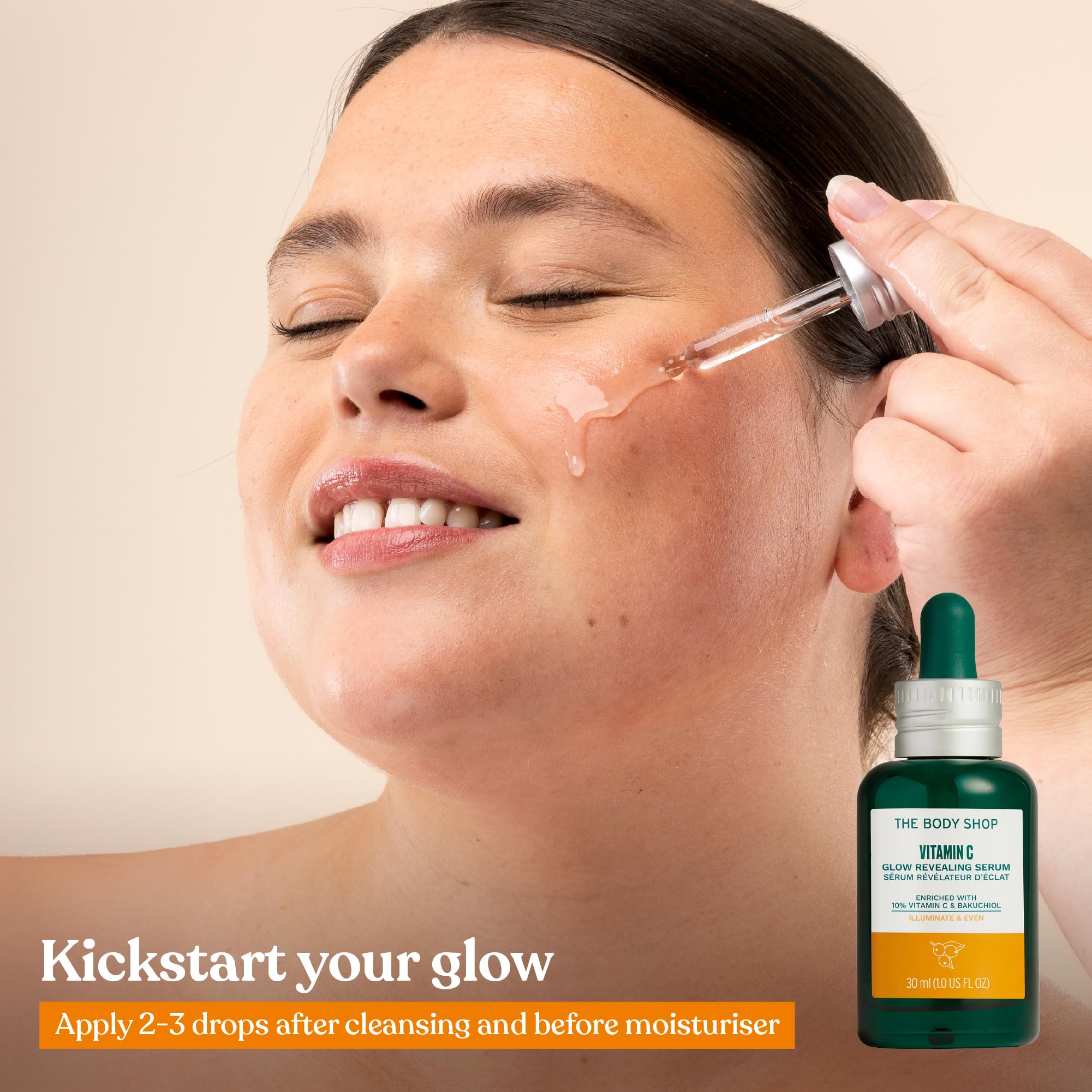 Hands applying The Body Shop Vitamin C Glow Revealing Serum during morning routine