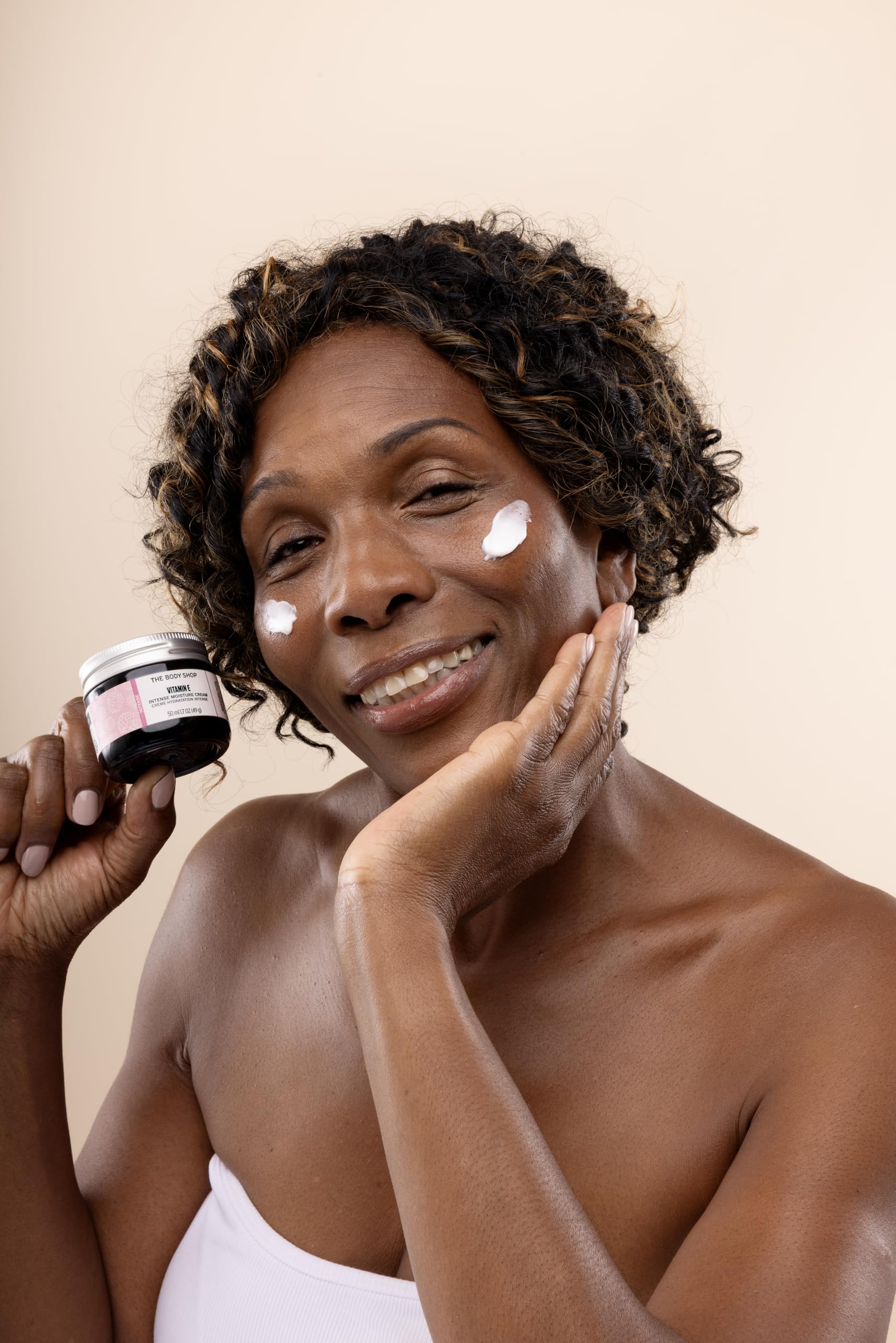 The Body Shop Vitamin E Intense Moisturizer swirl on skin demonstrates quick hydration.
