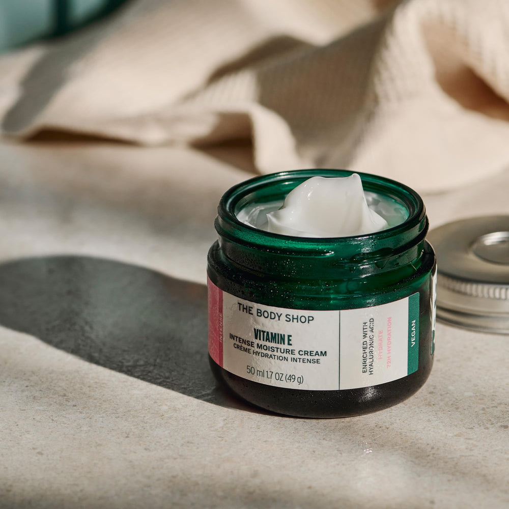 The Body Shop Vitamin E Intense Moisturizer packaging on shelf signals premium hydration.