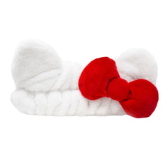 The Crème Shop Hello Kitty plush spa headband front view with bow keeps hair tidy during cleansing.