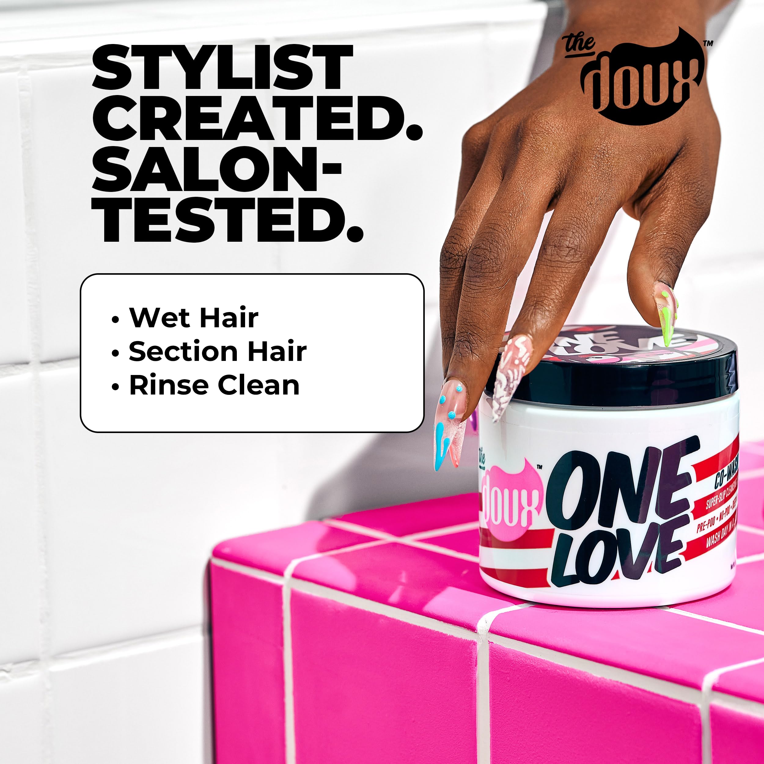 The Doux ONE LOVE co-wash ingredients jar shows jojoba and grapeseed oils for hydration.