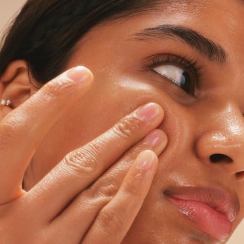 The Face Shop Rice Water Bright Light Cleansing Oil nozzle dispensing a silky makeup-melting texture.