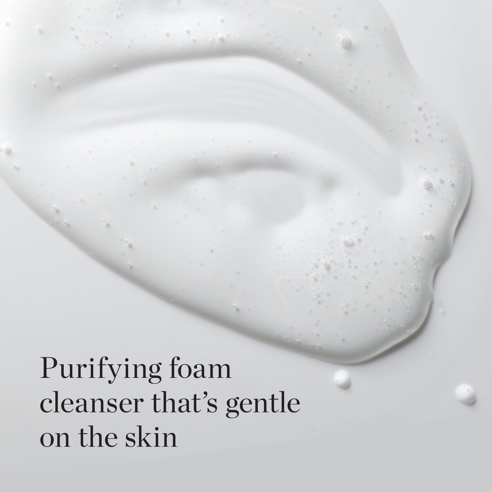 The Face Shop White Seed Exfoliating Cleansing Foam bottle closeup highlights texture and moisturizing formula.