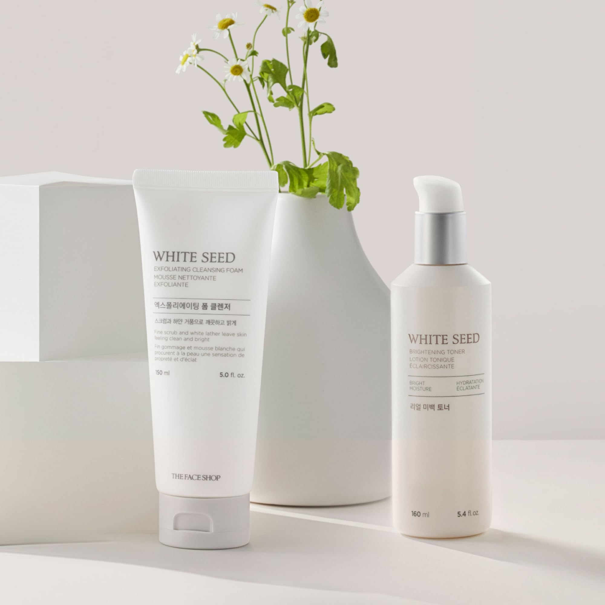 The Face Shop White Seed Exfoliating Cleansing Foam with Daisy and Lupin extracts conveys botanical care.