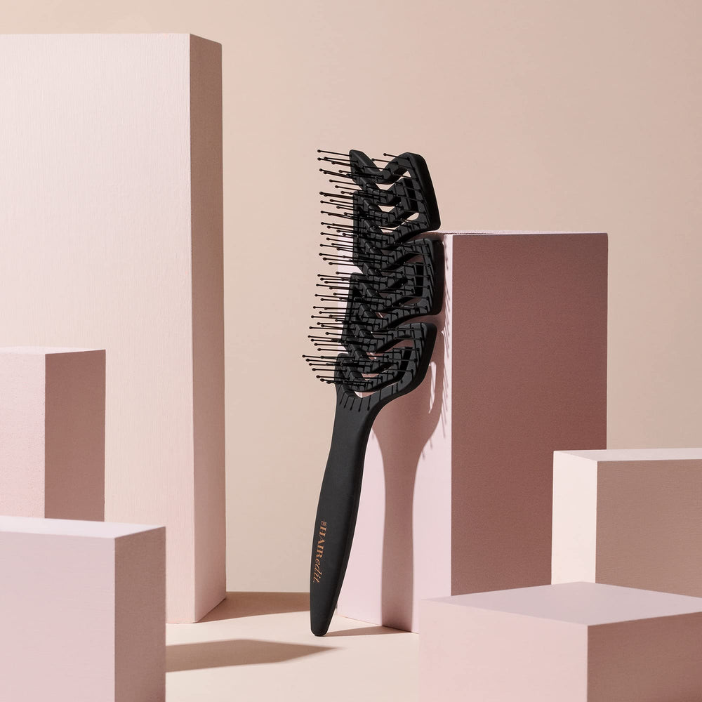 The Hair Edit anti-breakage brush reduces stress on strands while preserving curl and straight hair.