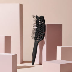 The Hair Edit anti-breakage brush reduces stress on strands while preserving curl and straight hair.