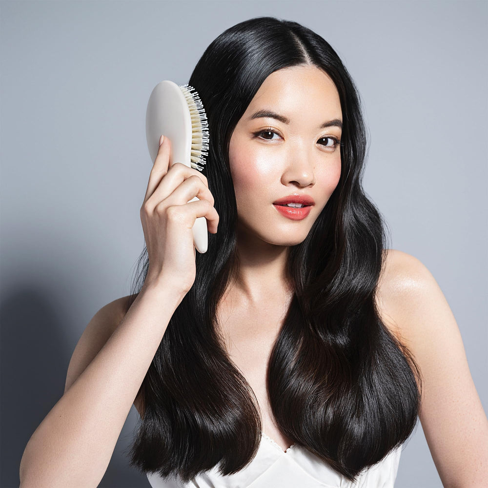 The Hair Edit Cream Finish and Shine brush close-up shows boar bristles distributing moisture for shine