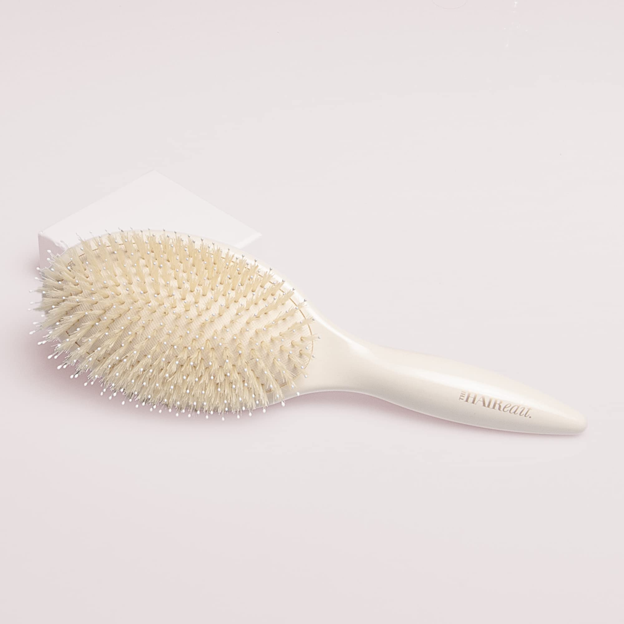 The Hair Edit Cream Finish and Shine brush detangling action eases tangles without pulling
