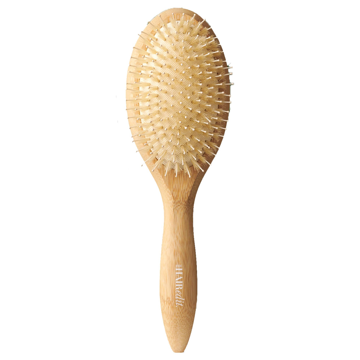 The Hair Edit Glossifier bamboo brush with boar bristles for smoothing frizz and boosting shine.