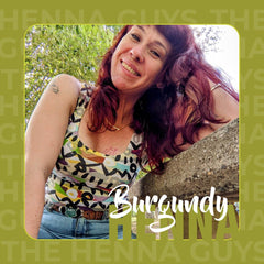 The Henna Guys burgundy hair application spread demonstrates even color application.
