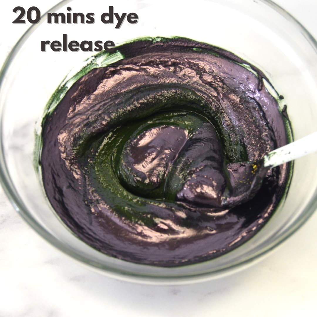 Indigo powder in bowl demonstrates plant-based dyeing process for hair.