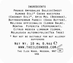 The Ilex Wood open tube texture revealing smooth balm surface and easy glide benefit