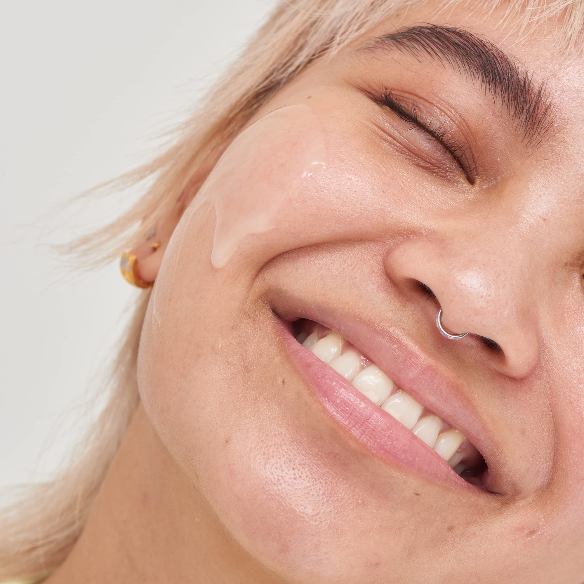 Applying The INKEY List Niacinamide Serum onto face for blemish-prone skin.