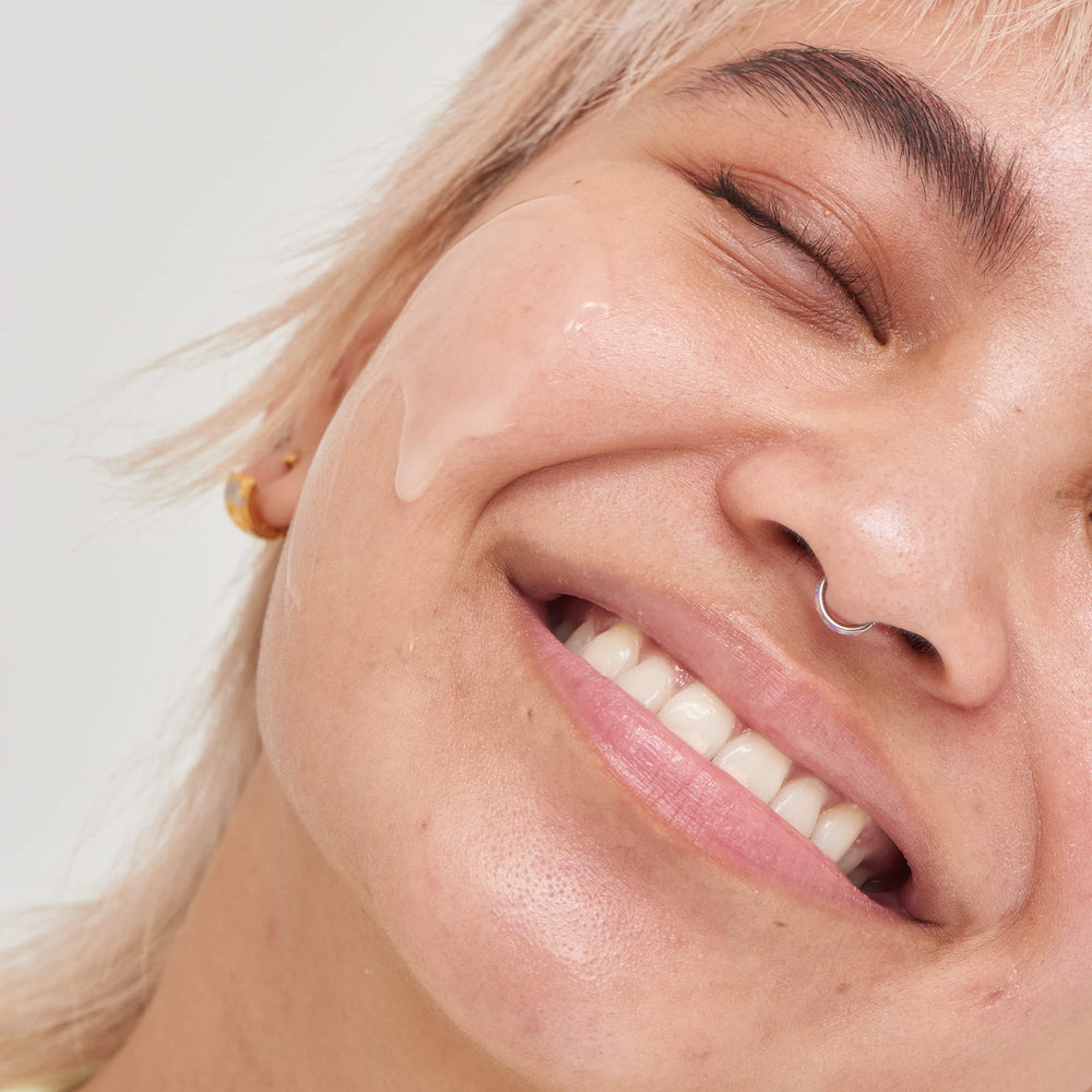 Applying The INKEY List Niacinamide Serum onto face for blemish-prone skin.