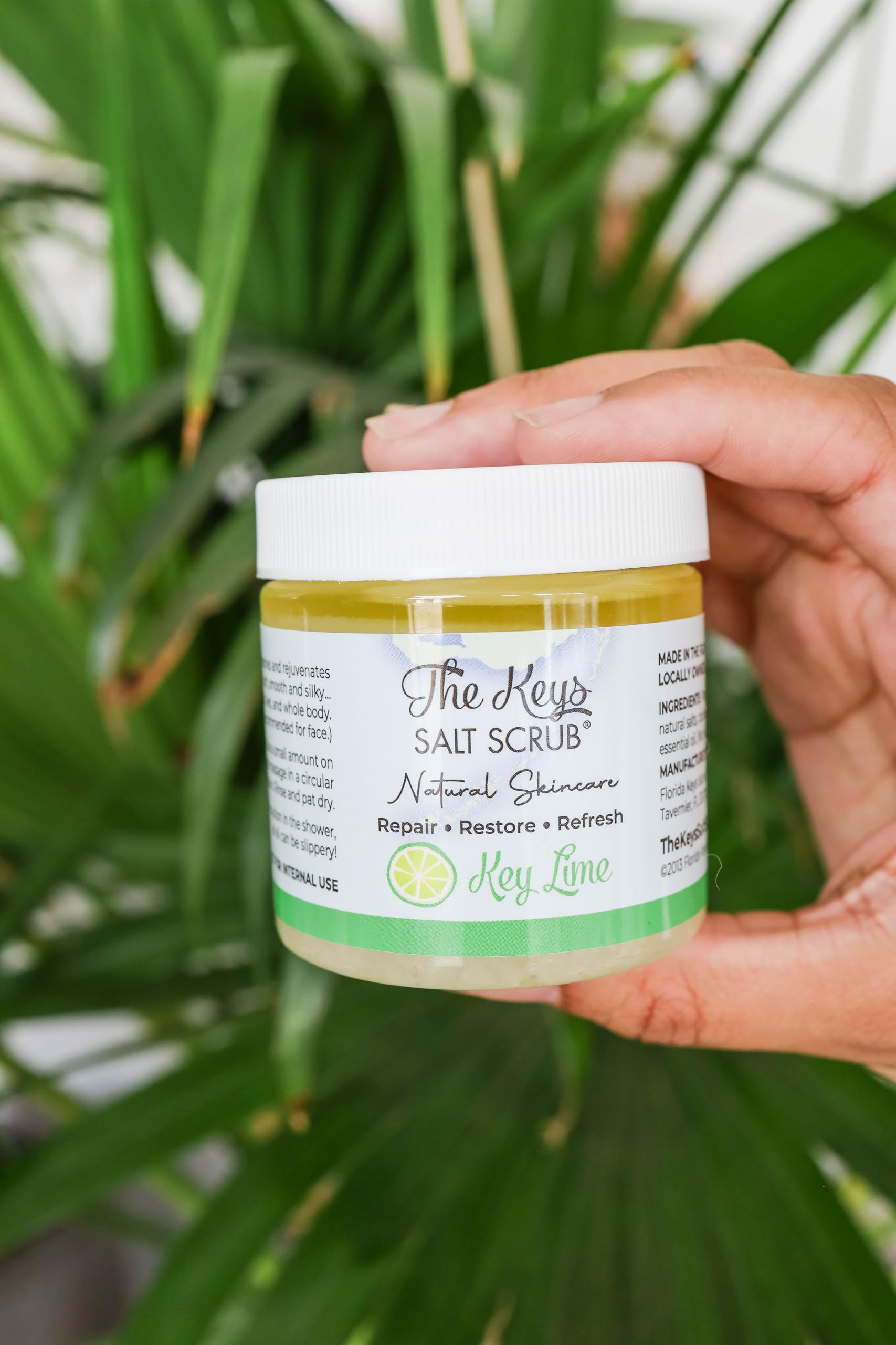 The Keys Salt Scrub in a bath or shower setup for moisturized skin