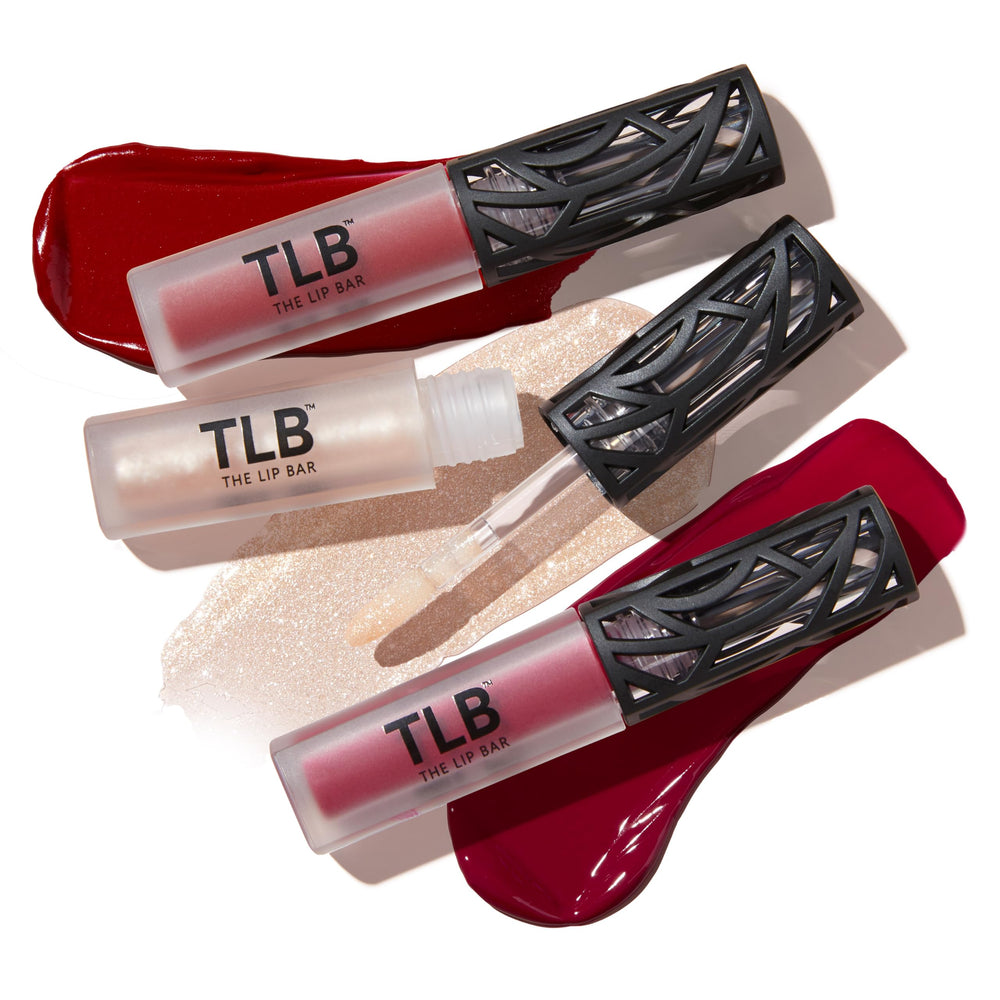 The Lip Bar Bawse Lady Nonstop Liquid Matte red swatch on skin shows bold, universal red.