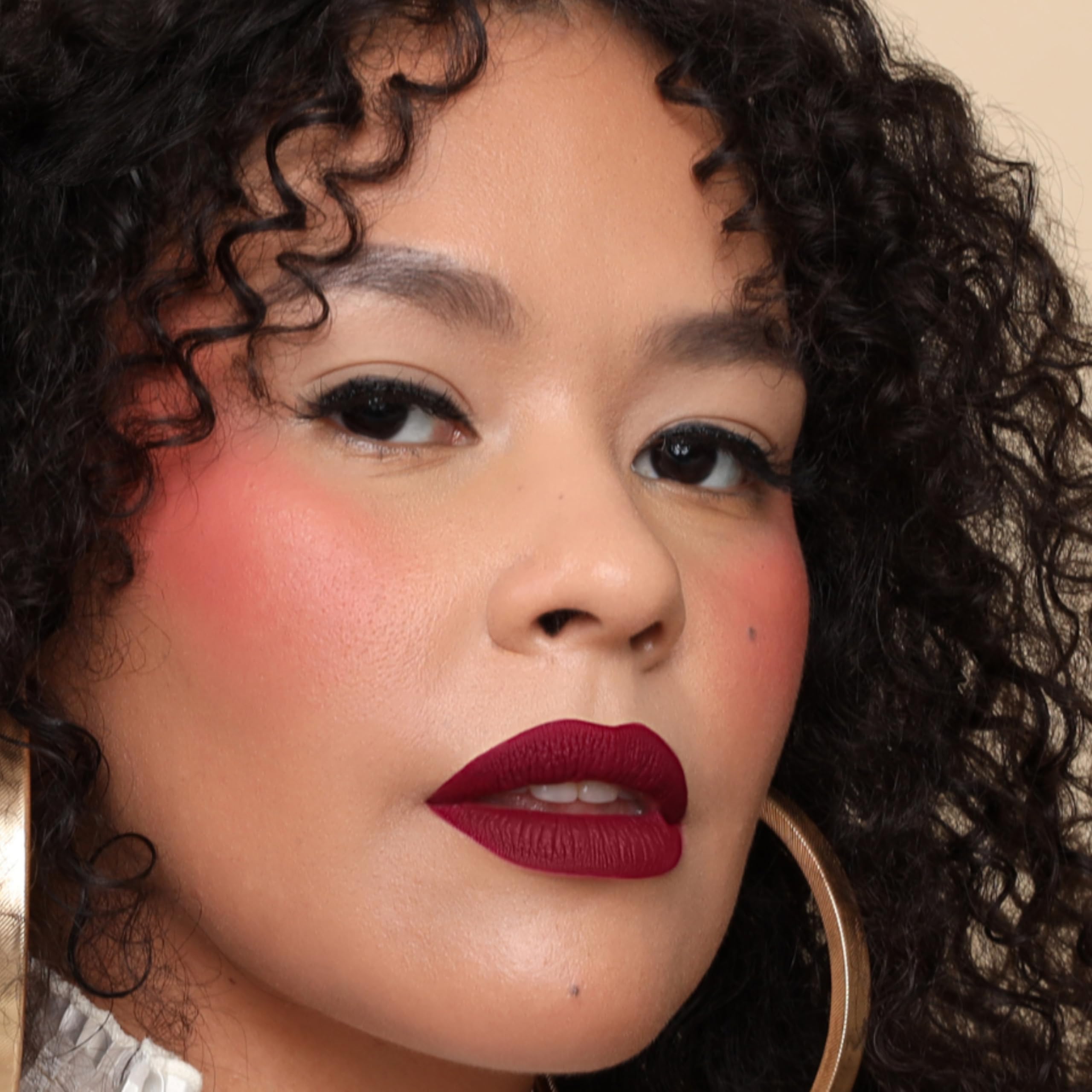 The Lip Bar layer with gloss demonstrates versatile shine and dimension.