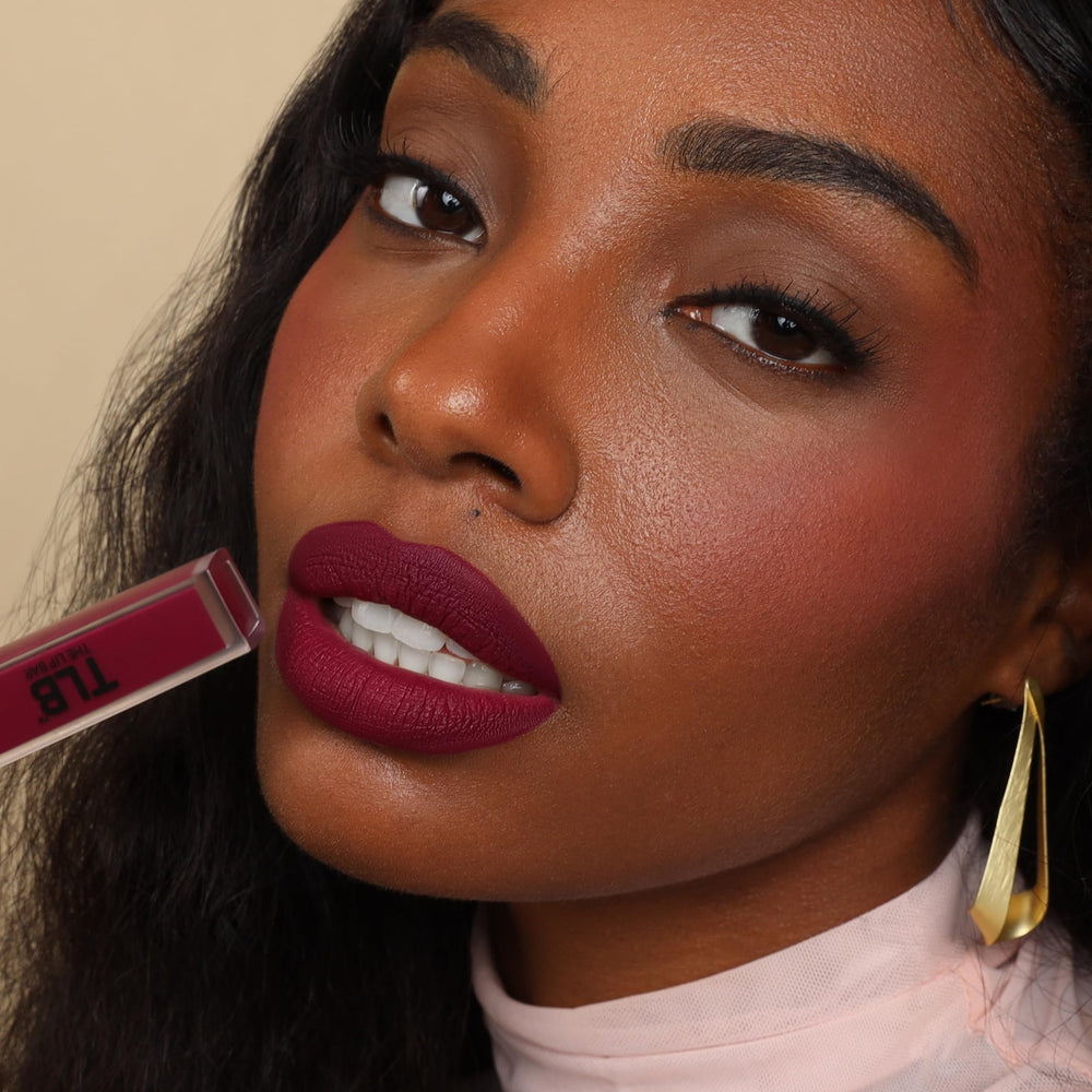 The Lip Bar mini-packaging closeup highlights portable, travel-ready design.