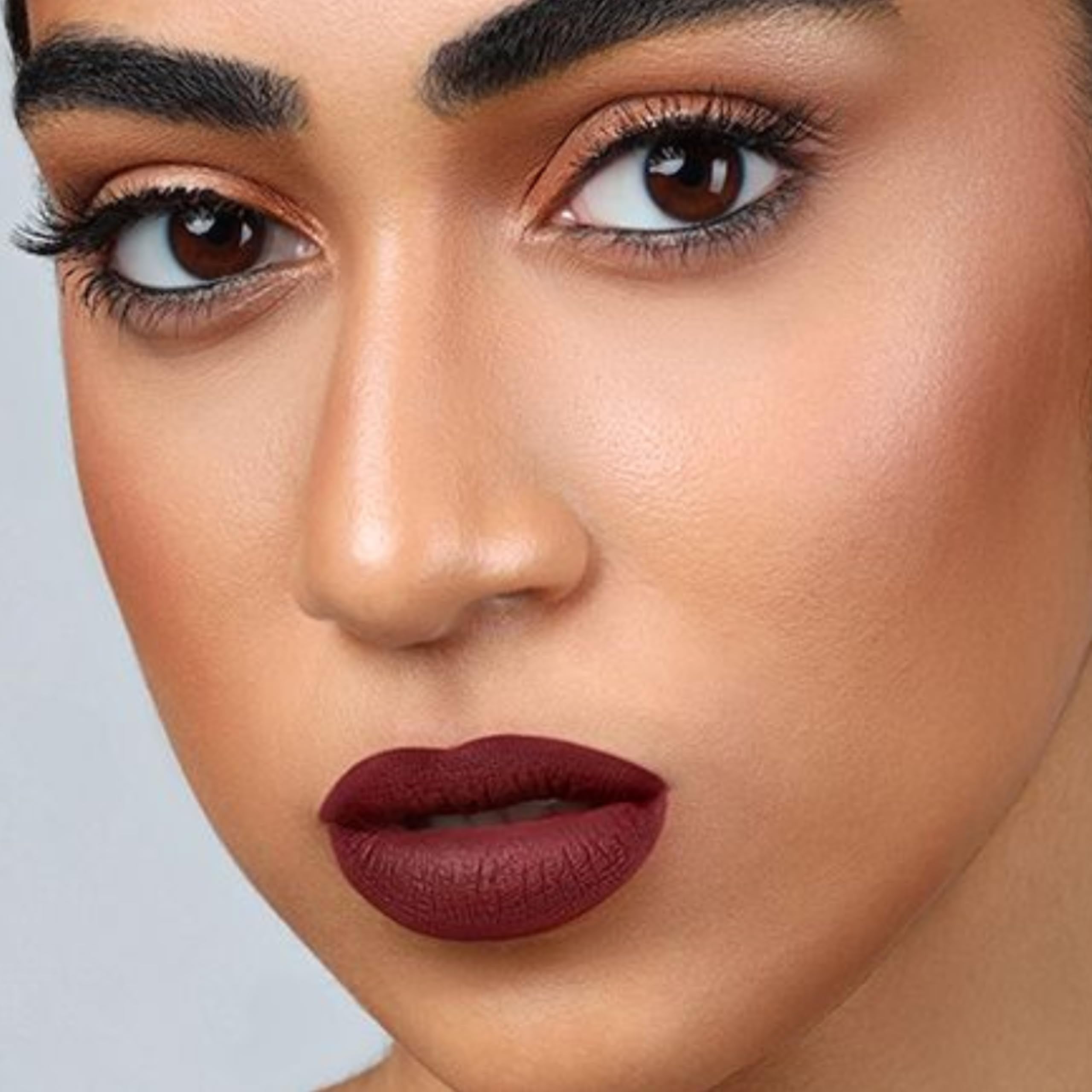 The Lip Bar vegan packaging closeup signals cruelty-free, clean beauty.