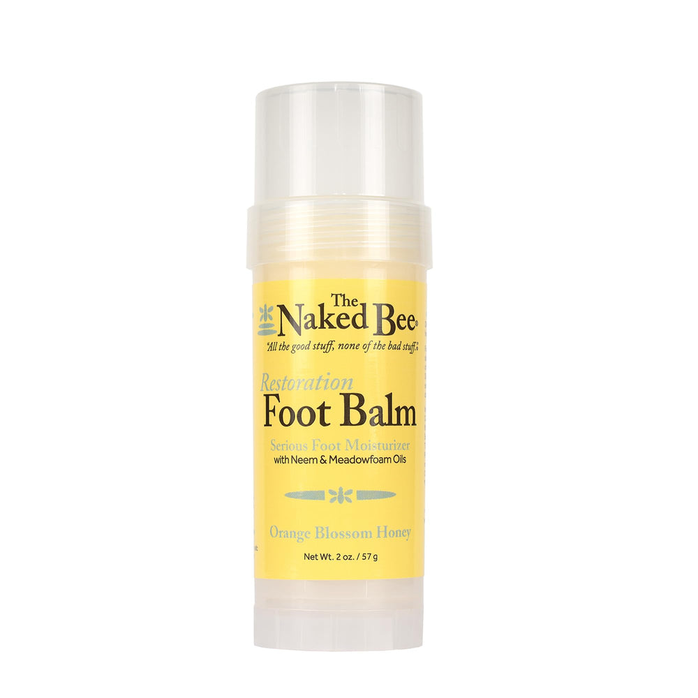 The Naked Bee foot balm restoration-heel 2oz bottle demonstrates intense hydration for dry feet.