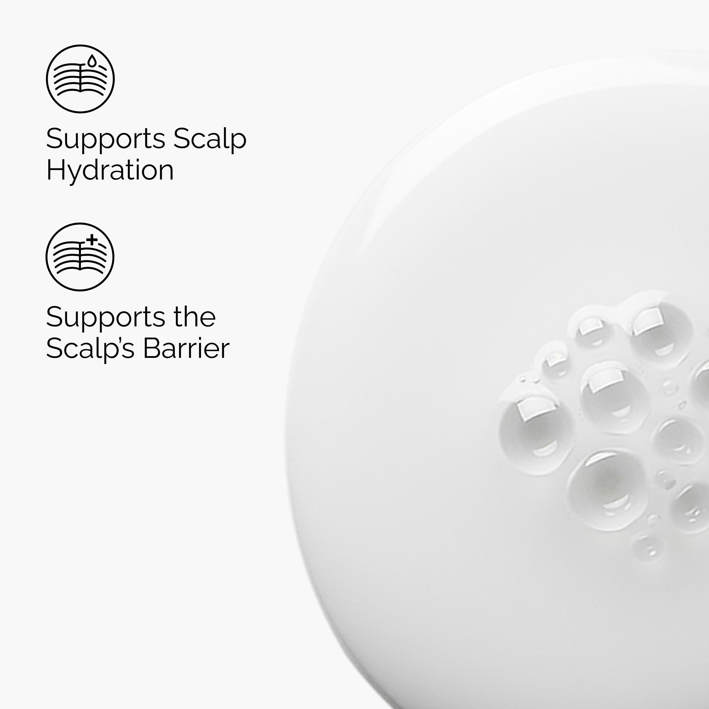 Milky formula applied to the scalp indicating quick absorption and non-greasy feel.