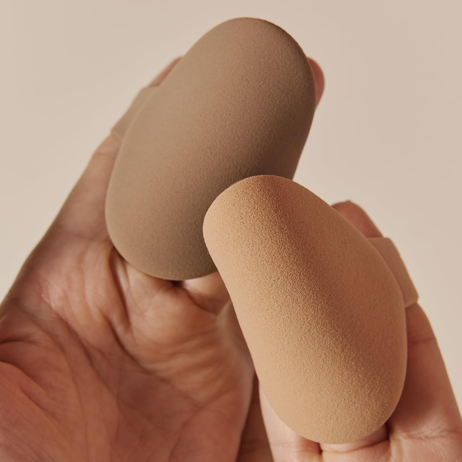 Foundation brush application on skin yields natural, buildable base with minimal streaks.