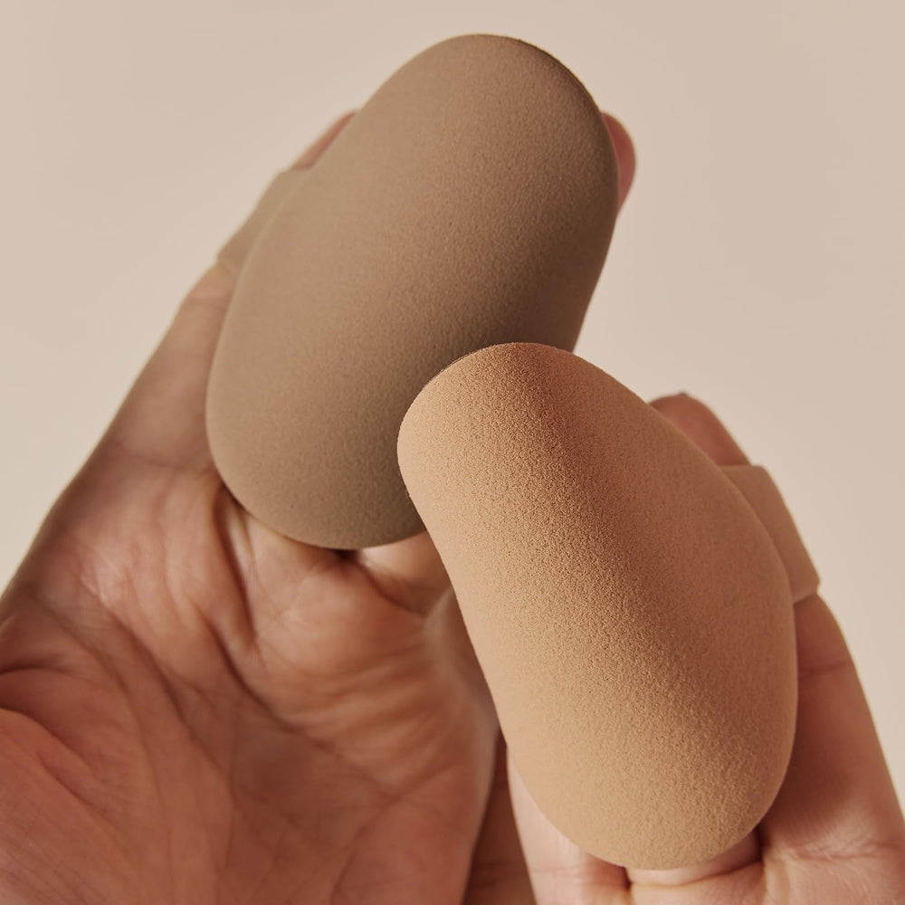 Foundation brush application on skin yields natural, buildable base with minimal streaks.