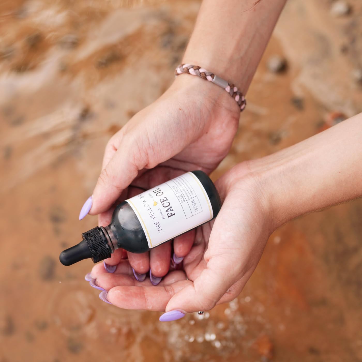 The Yellow Bird Balancing Blue Tansy Face Oil with olive squalane and jojoba nourishes skin.