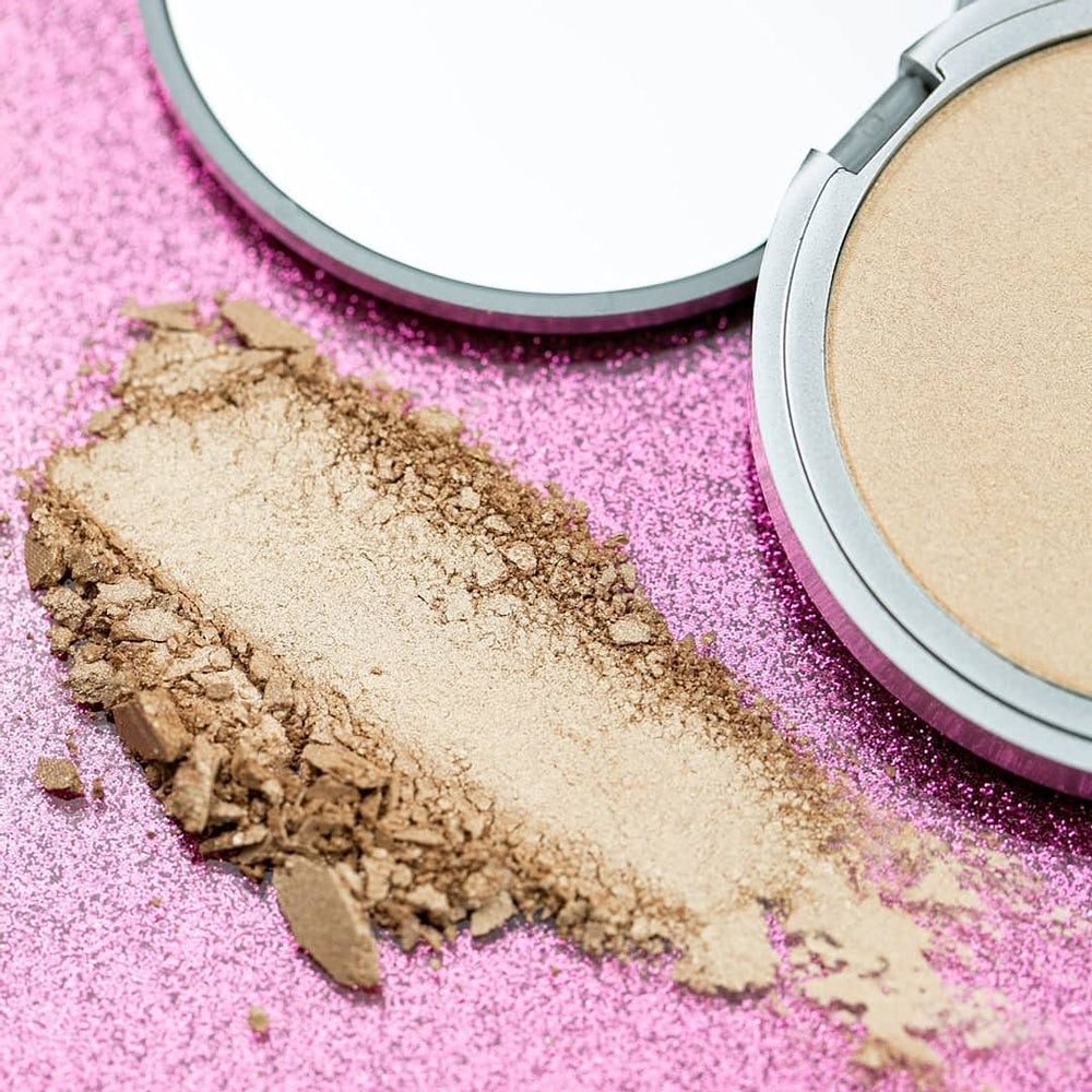theBalm travel-size packaging closeup emphasizes portable shimmer for on-the-go looks