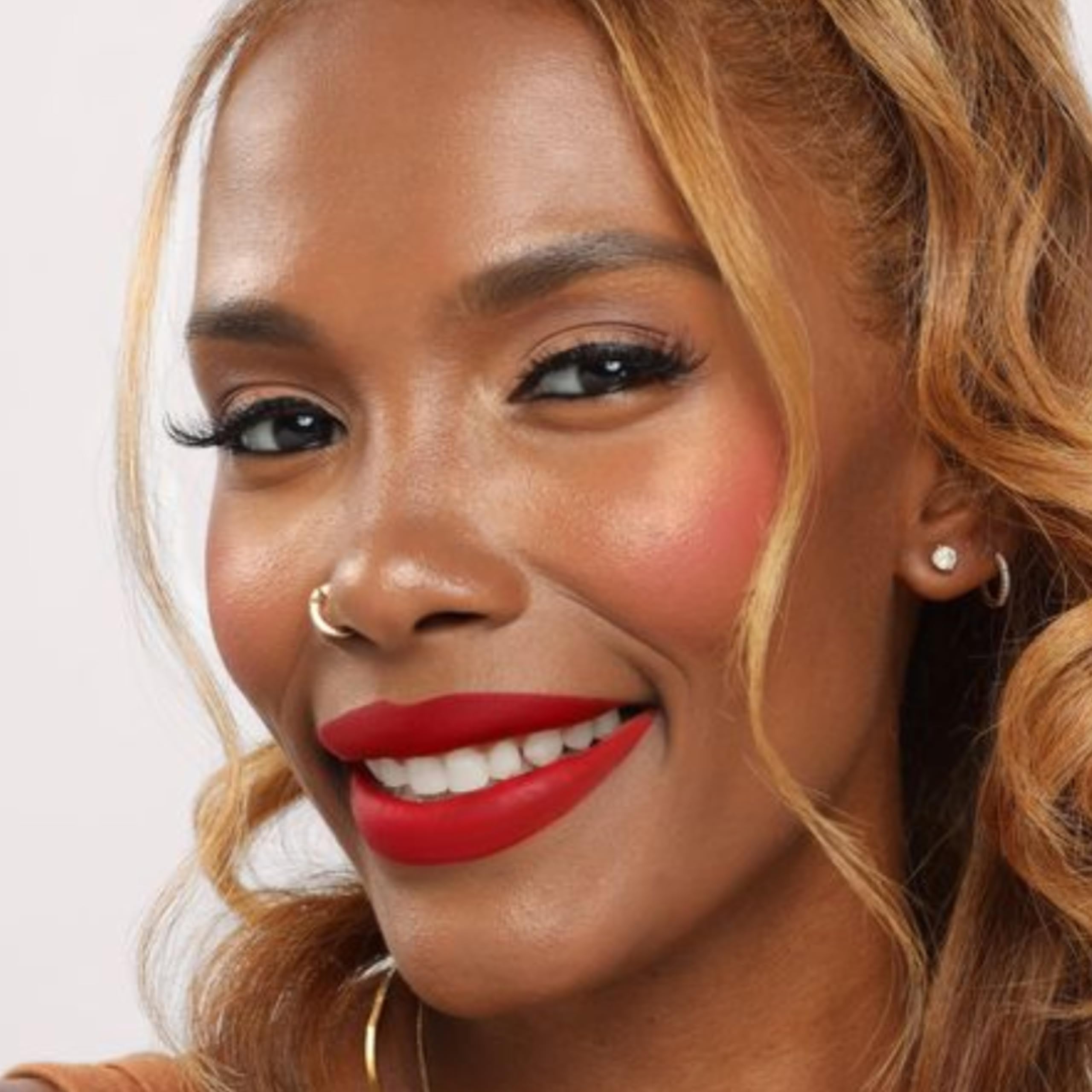 The Lip Bar Bawse Lady layer with lip gloss for high-shine possibilities.