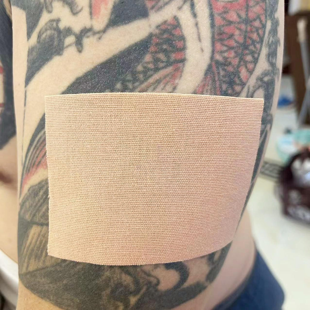 Therasports tattoo cover up tape application demonstrates easy peel and stick