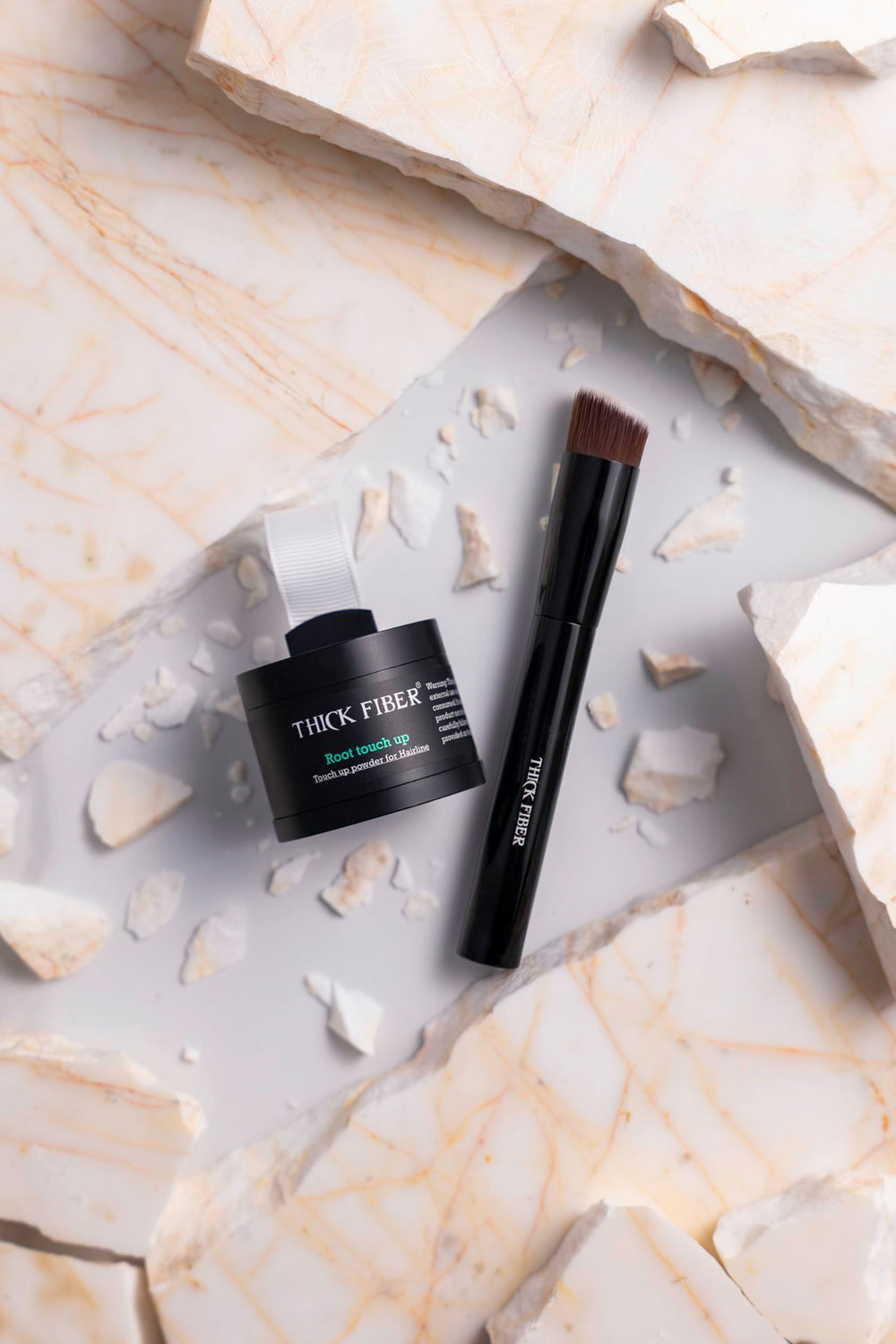 Thick Fiber box includes puff and brush for easy application.