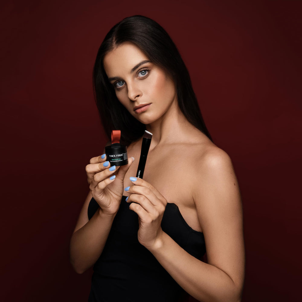 Thick Fiber user applying product for a natural-looking fuller hairline